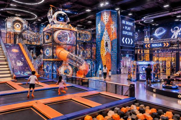 Immersive indoor playground theme with multiple attractions for a family entertainment center