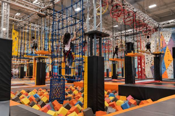 challenging ninja course with foam pit in an indoor adventure park
